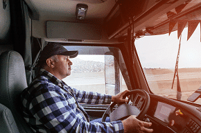 professional driver in cab of his rig